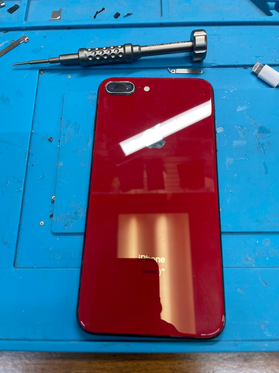 Repaired red iPhone back glass